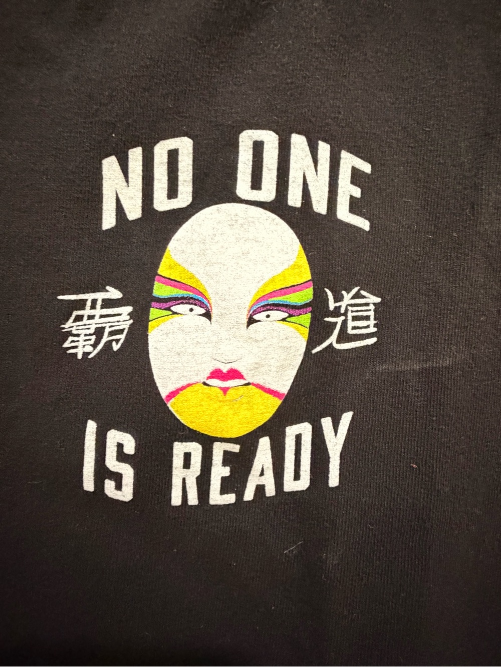 WWE Black Tee with Yellow, Pink, Green and Purple Theatrical Makeup Face
